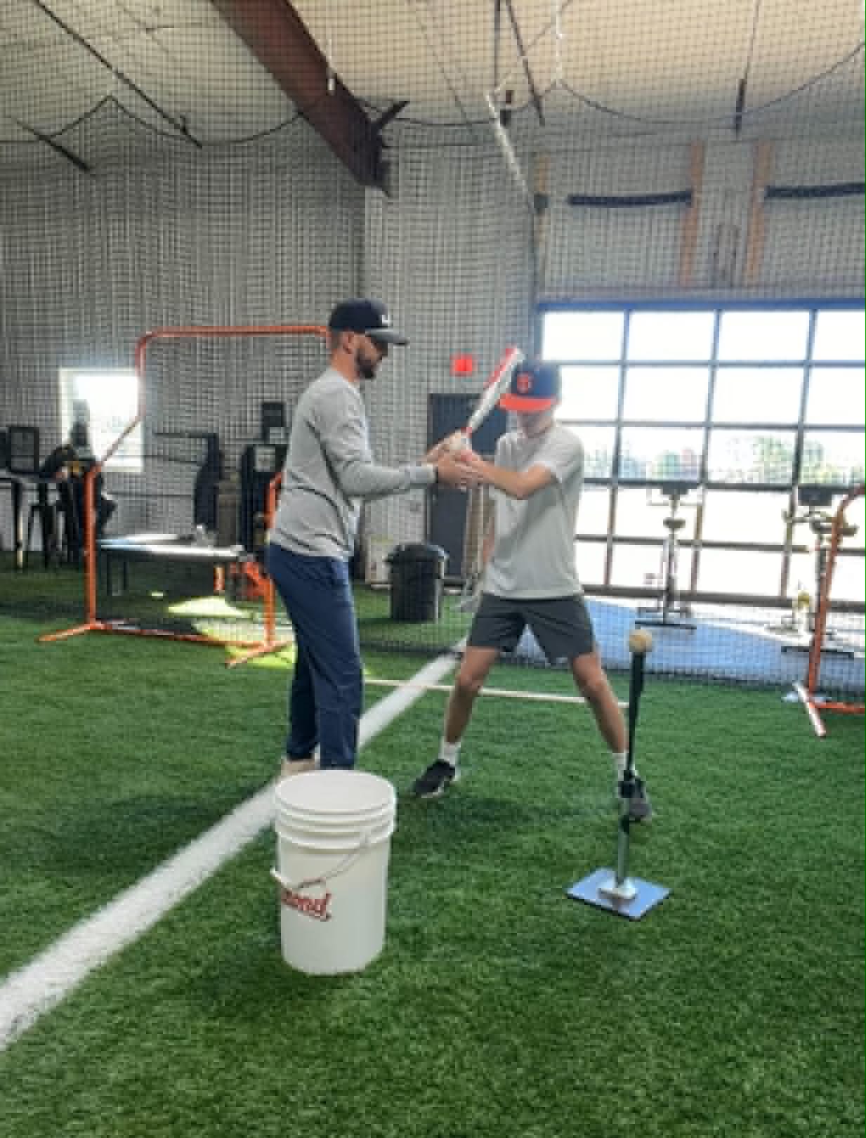 Pat Tschida working on hitting mechanics with a player off the tee