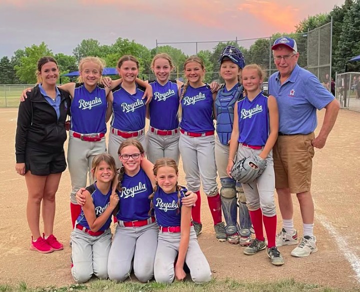 Liz Gerads with the Royals softball team at sunset
