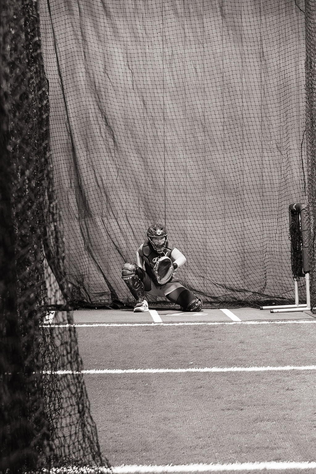 Catcher framing a pitch in the cage at The Lab Watertown